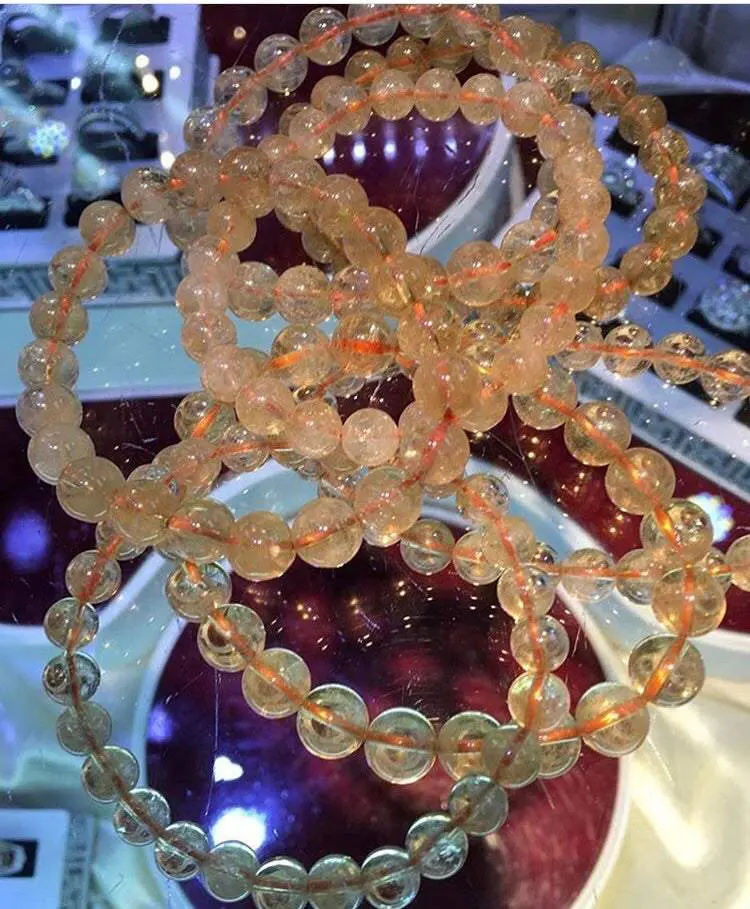 Yellow gemstone bracelets on display. Yellow gemstone bracelets on display.