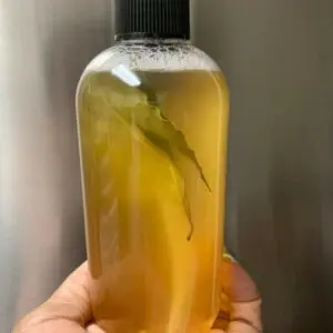 Yellow liquid soap bottle with leaf.