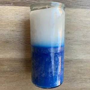 Blue and white glass jar candle.