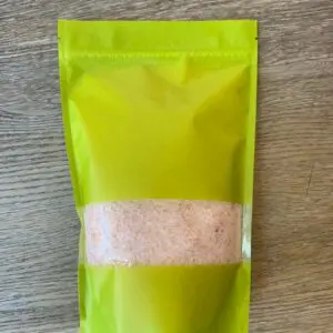 Pink Himalayan salt in a green bag.