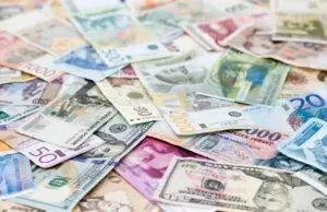 Pile of colorful foreign banknotes.