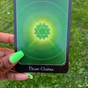 Green heart chakra card with a star