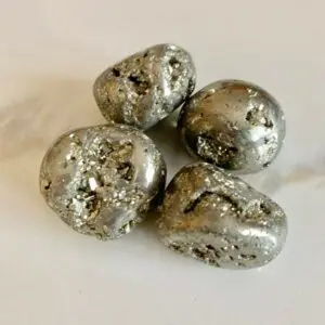 Four smooth, silver pyrite stones.
