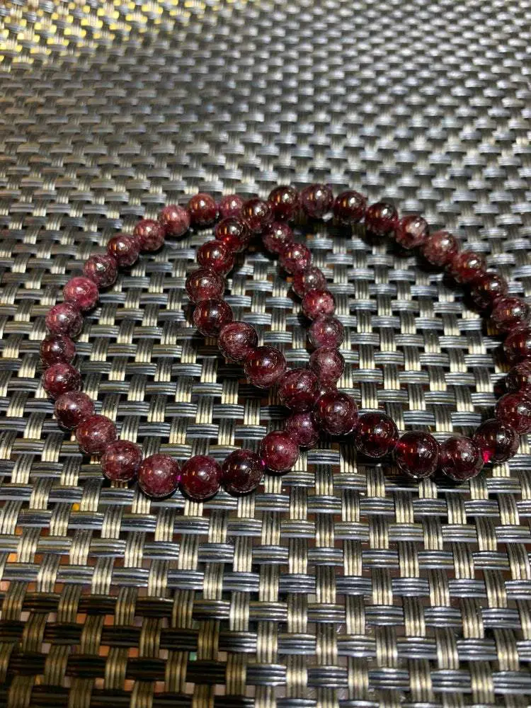 Two red gemstone beaded bracelets. Two red gemstone beaded bracelets.