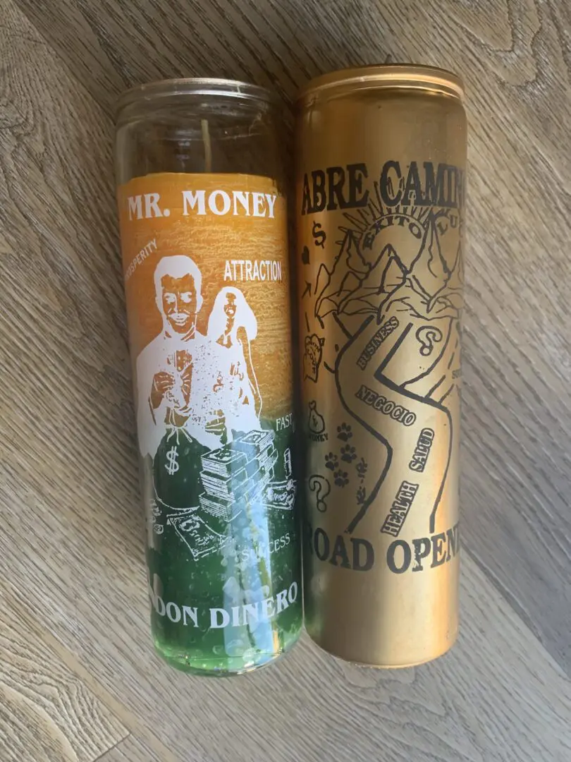 Two gold and green candles on wood. Two gold and green candles on wood.