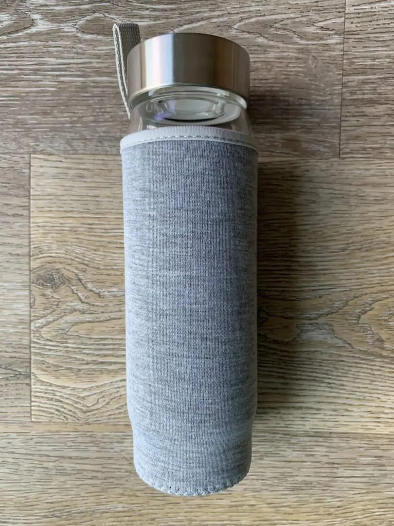 Gray insulated glass water bottle. Gray insulated glass water bottle.