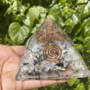 Crystal pyramid with copper wire.