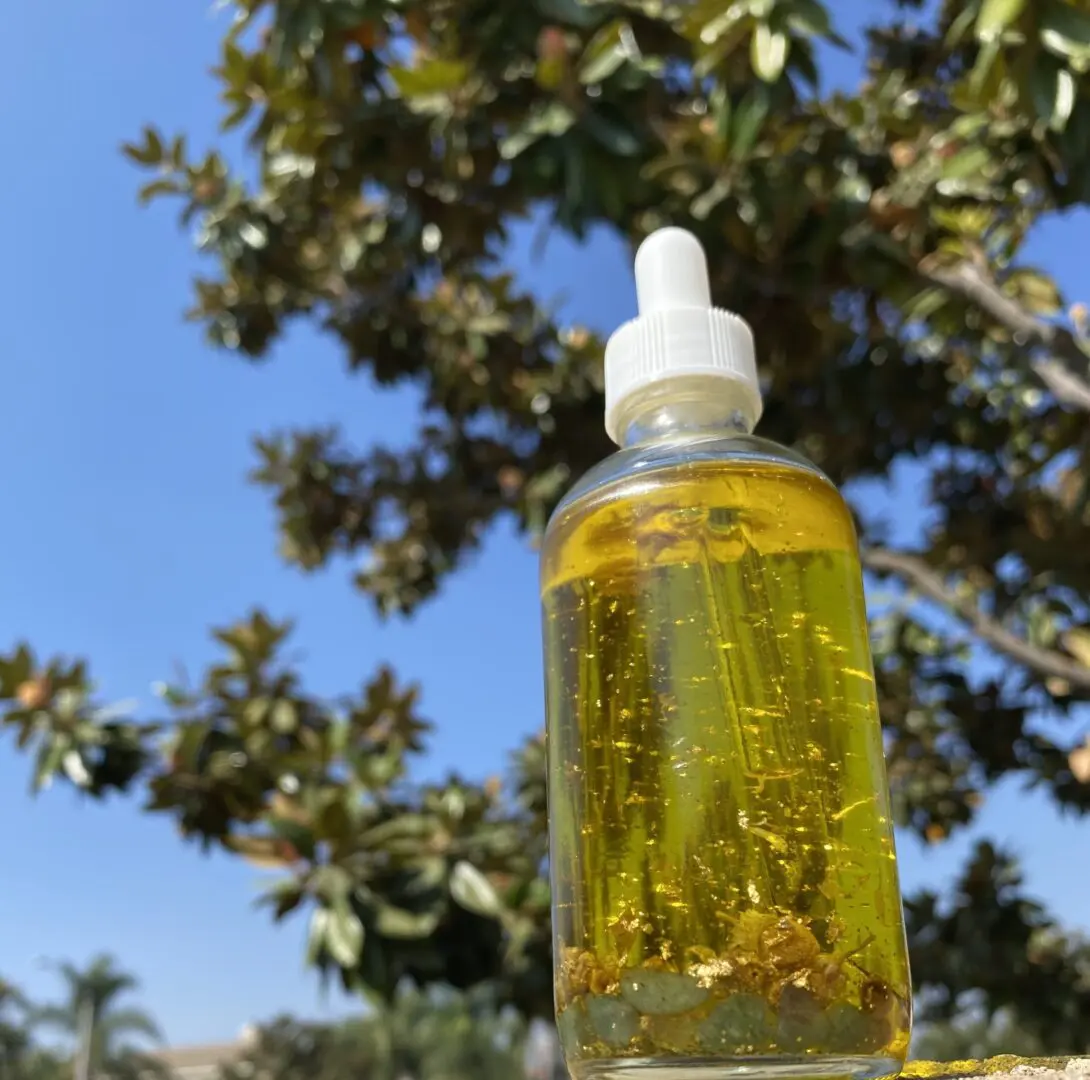 Glass bottle with gold flakes and herbs. Glass bottle with gold flakes and herbs.