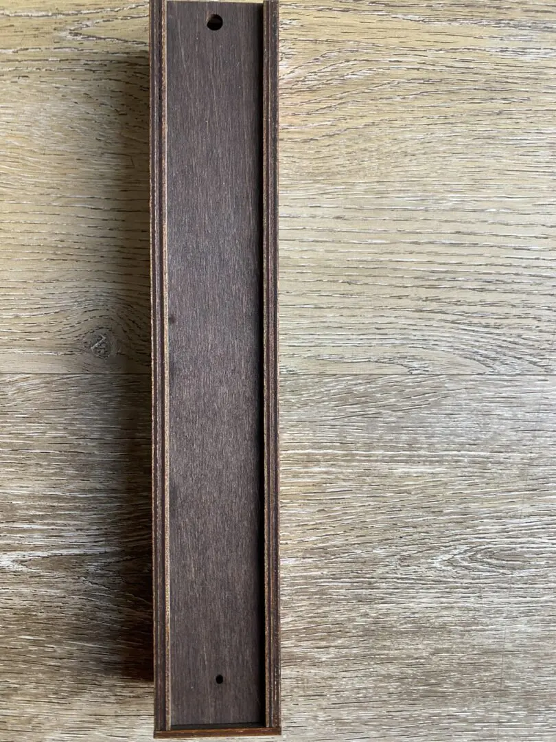Dark wooden frame against light woodgrain. Dark wooden frame against light woodgrain.