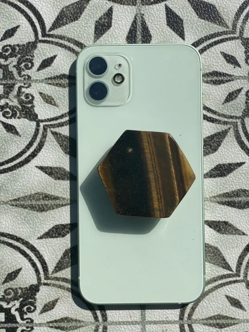 A phone that is sitting on top of a table. A phone that is sitting on top of a table.