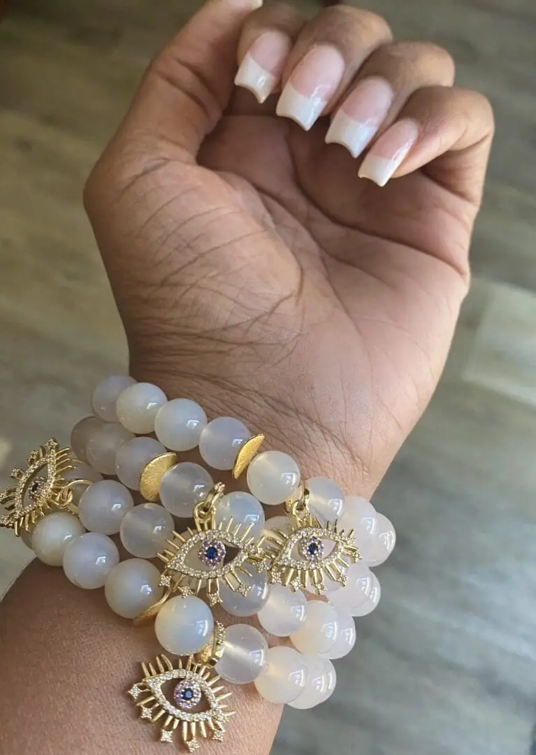 A hand with some bracelets on it A hand with some bracelets on it