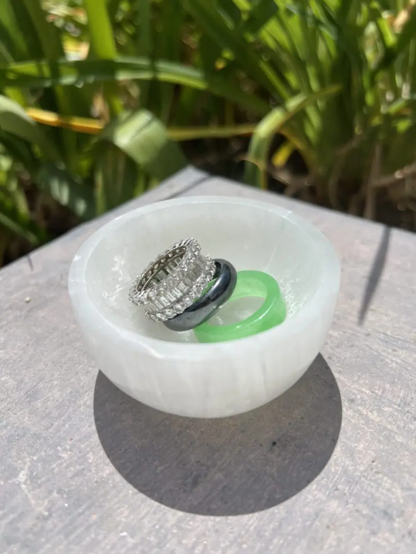 A white bowl with some rings in it A white bowl with some rings in it
