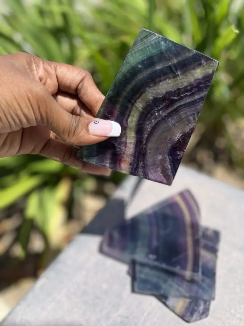 A person holding up a piece of paper A person holding up a piece of paper