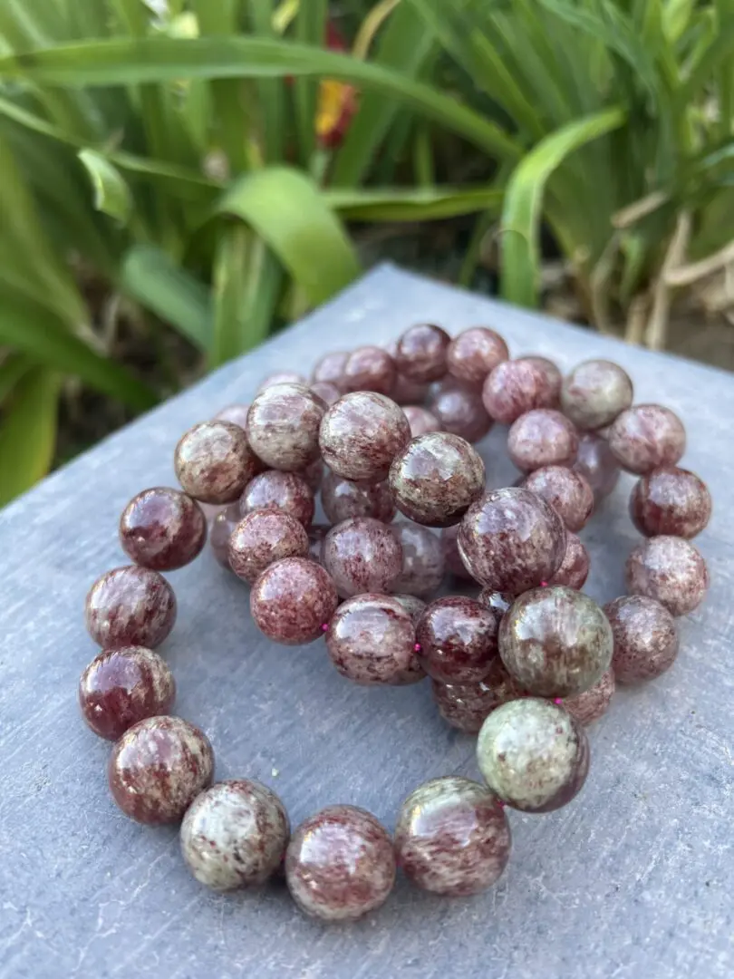 A close up of a necklace on some concrete A close up of a necklace on some concrete