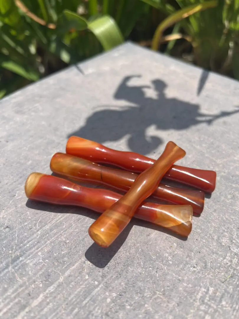 A close up of four sticks on the ground A close up of four sticks on the ground