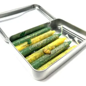 A tin of food with some green and yellow vegetables