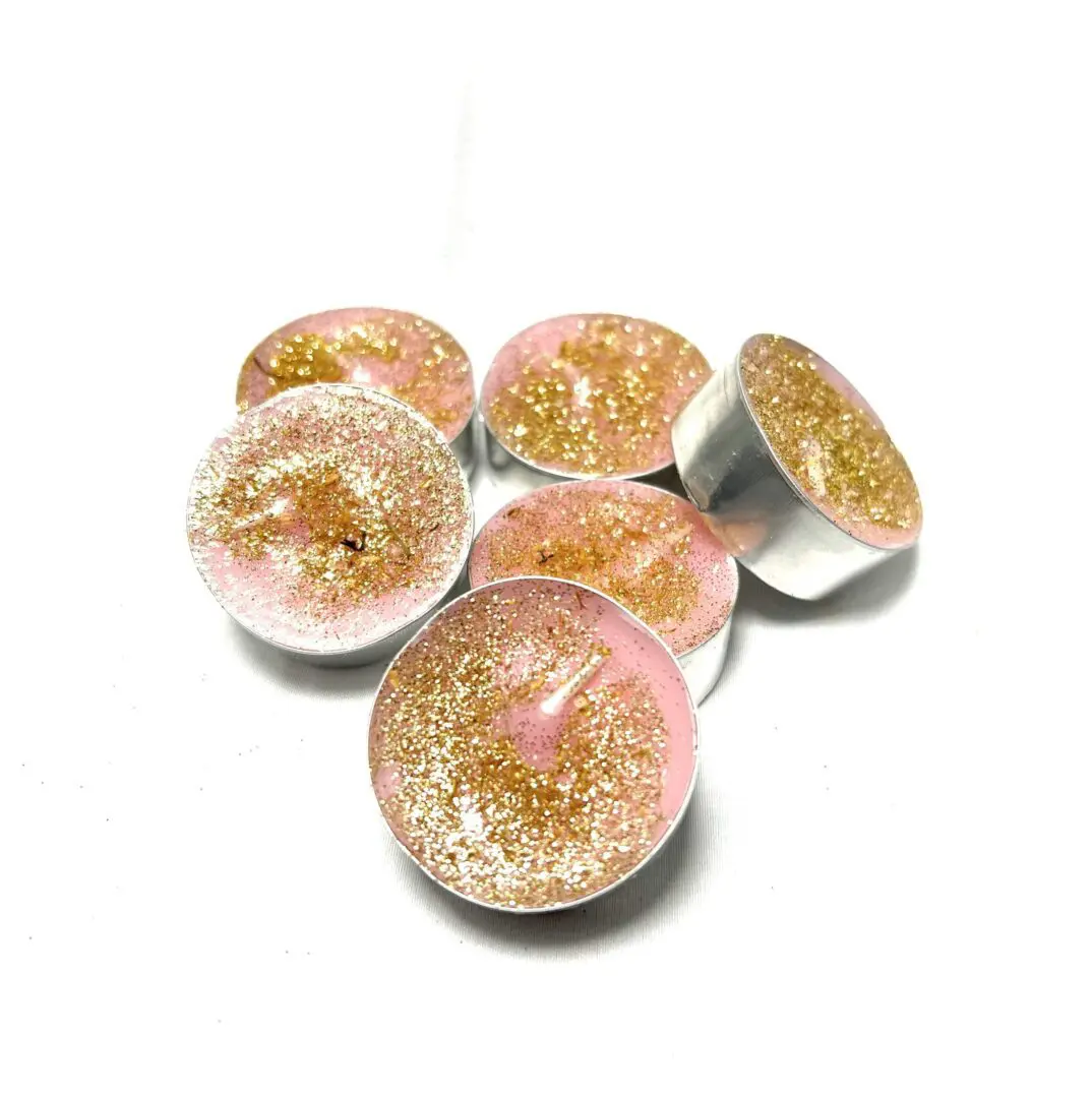 A group of six tea lights that are sitting on top of each other. A group of six tea lights that are sitting on top of each other.