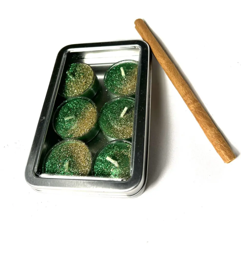 A tray of candles and a wooden stick A tray of candles and a wooden stick