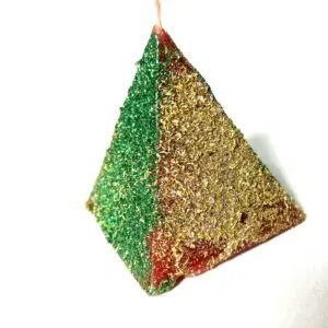 A green and red triangle ornament hanging from a string.
