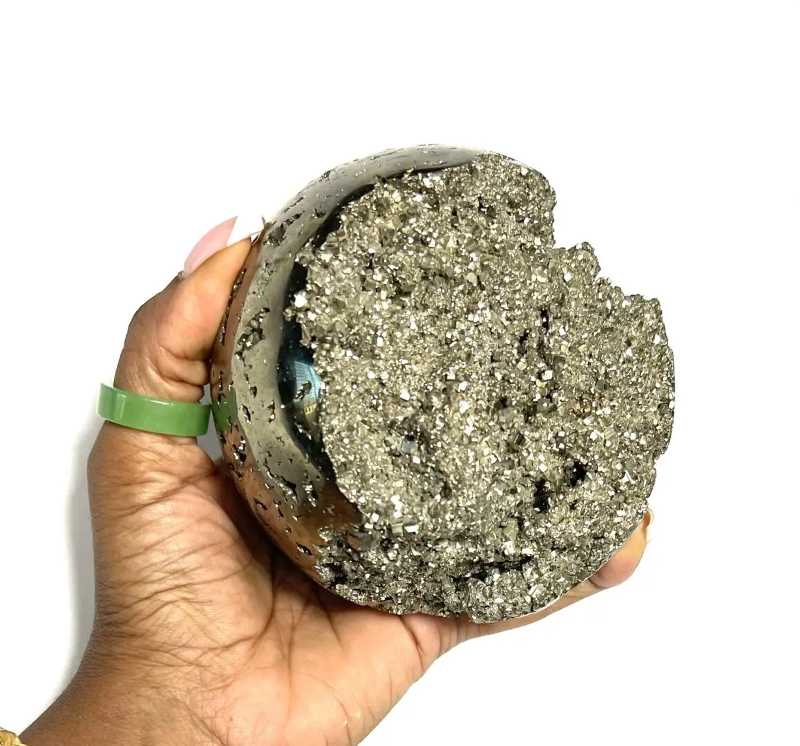 A person holding a rock in their hand. A person holding a rock in their hand.