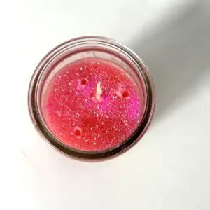 A candle is lit in the middle of a table.