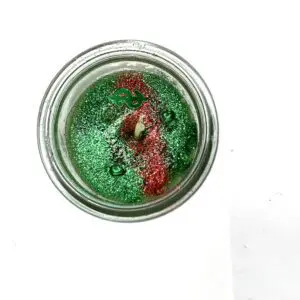 A candle is sitting in the middle of a table.