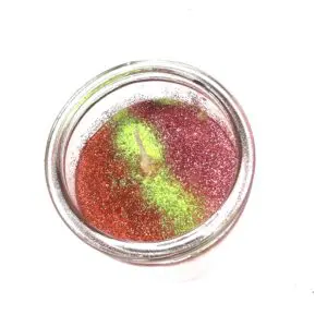 A jar of red and green sand
