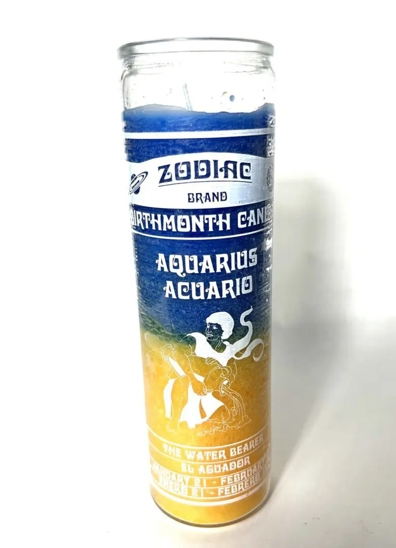 A candle that is sitting on the floor. A candle that is sitting on the floor.