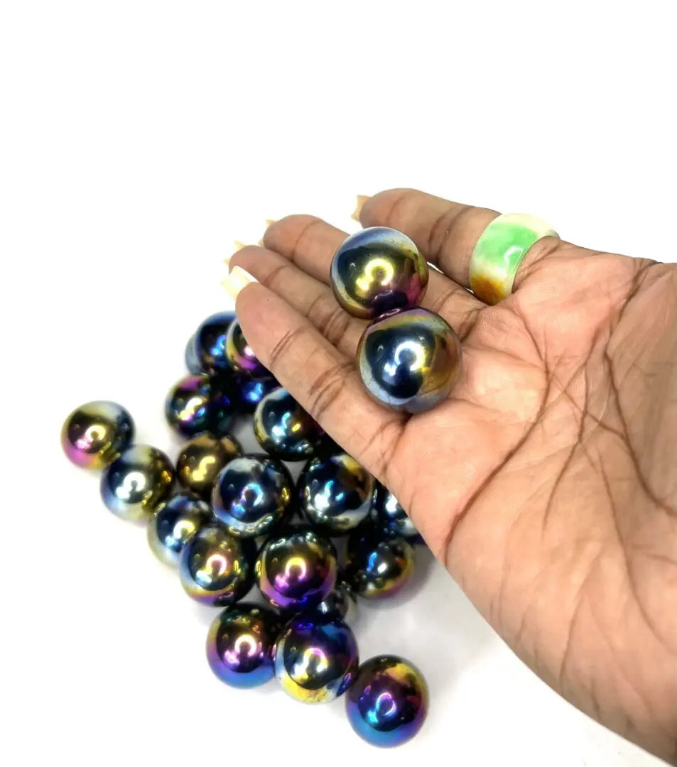 A hand holding a bunch of colorful balls A hand holding a bunch of colorful balls