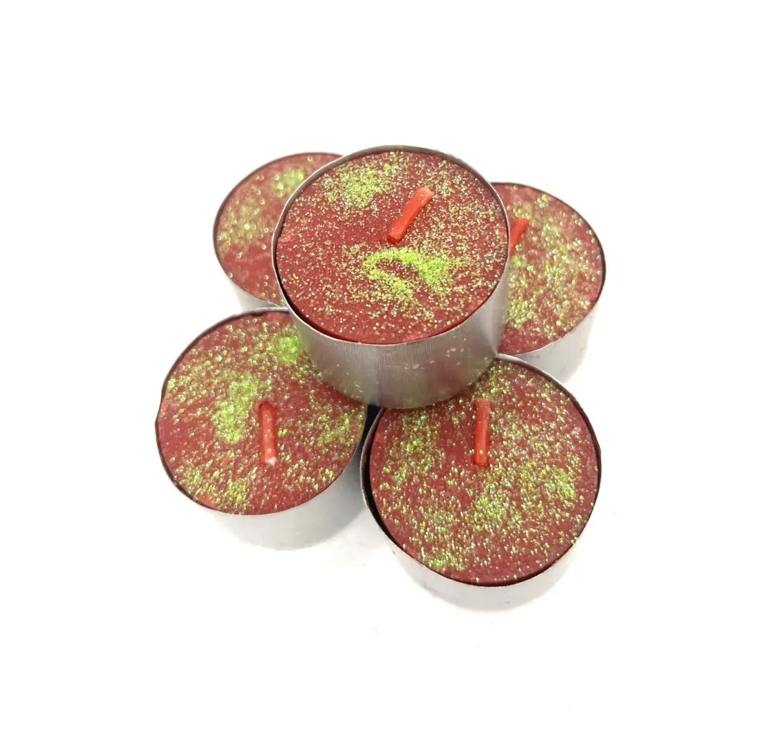 A group of six candles that are sitting on top of each other. A group of six candles that are sitting on top of each other.