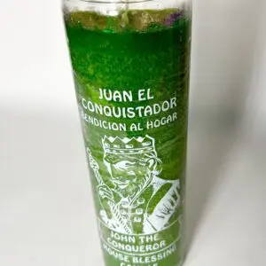 A green candle with the image of juan el conquistador.