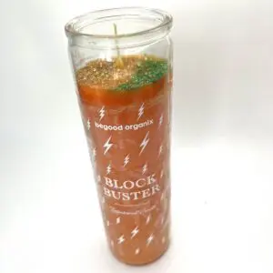 A candle that is sitting on the floor.