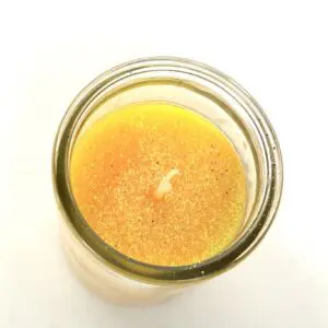 A jar of orange juice on top of a table.