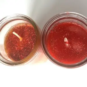 Two candles are sitting next to each other.