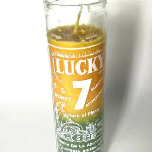 A candle that says lucky 7 on it.
