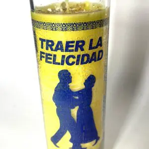 A candle with the words traer la felicidad written on it.