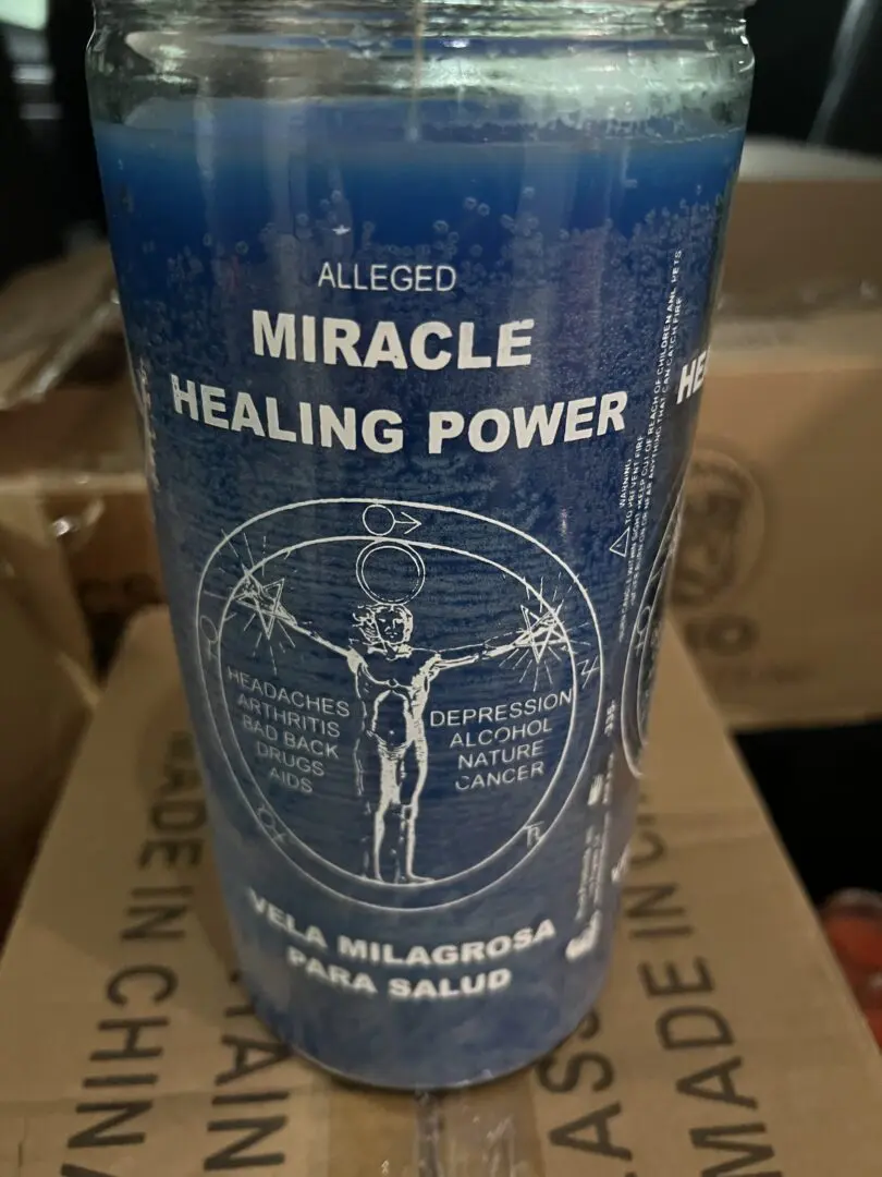 A cup of miracle healing power on top of a box. A cup of miracle healing power on top of a box.