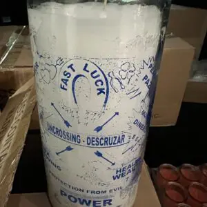 A candle that is sitting on some cardboard.