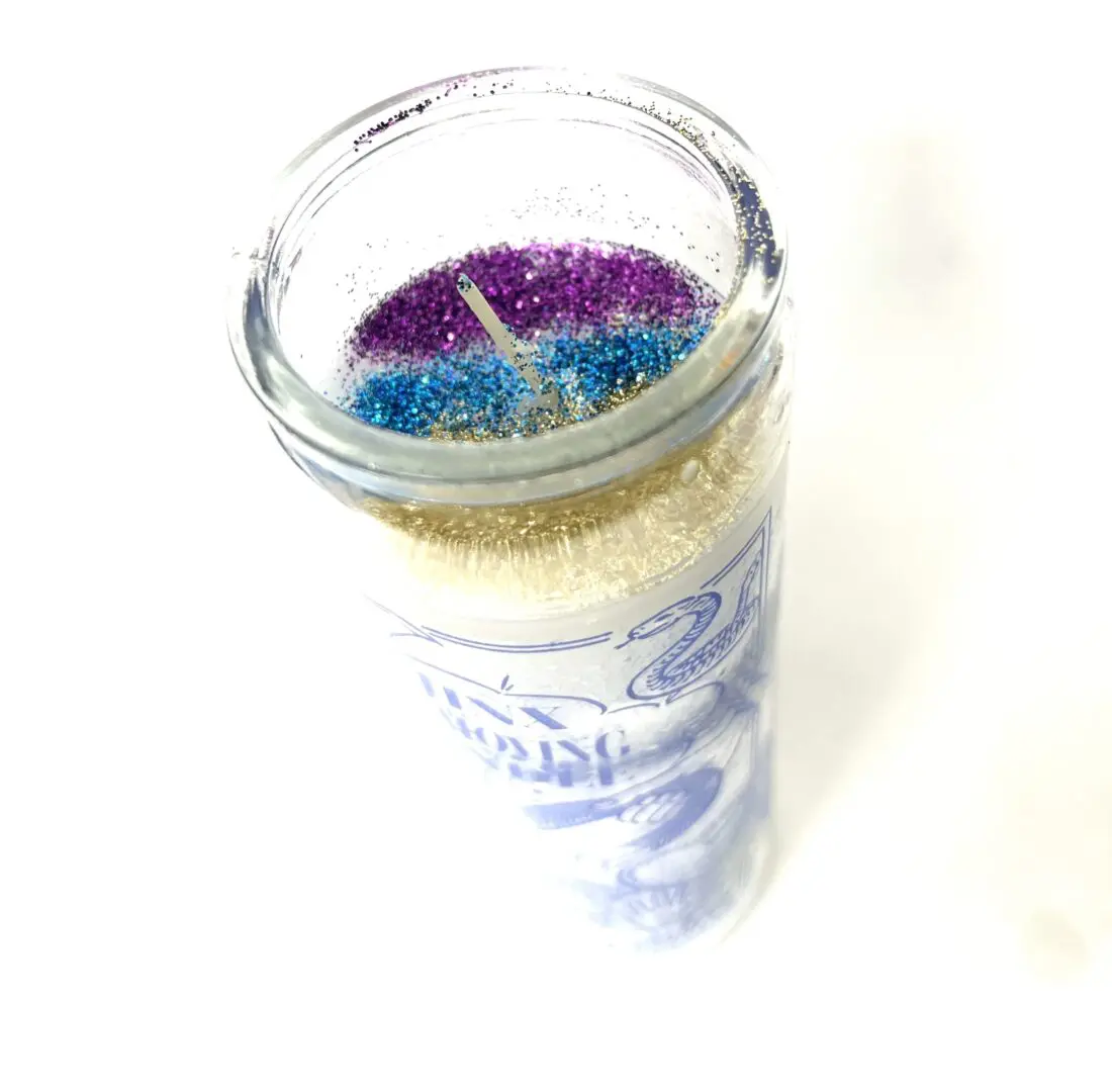 A candle that is sitting on top of a table. A candle that is sitting on top of a table.