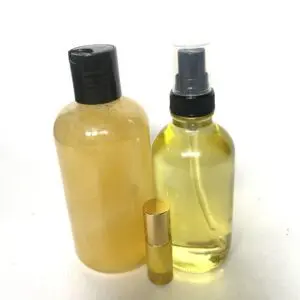 Two bottles of lotion and a roll of lip balm.