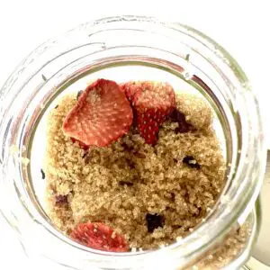 Dried strawberries in brown sugar jar.