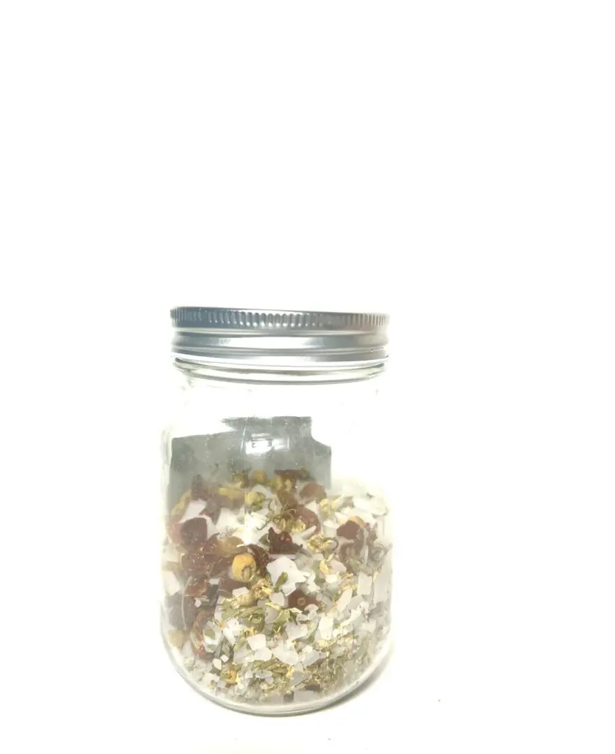 A glass jar filled with popcorn against a white background. A glass jar filled with popcorn against a white background.