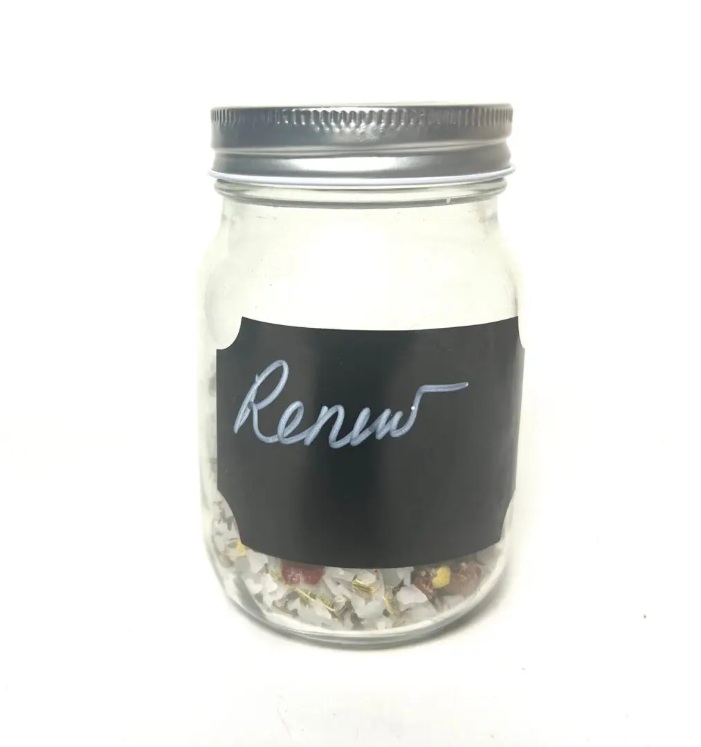 A glass jar with a chalkboard label reading 'Renew'. A glass jar with a chalkboard label reading 'Renew'.