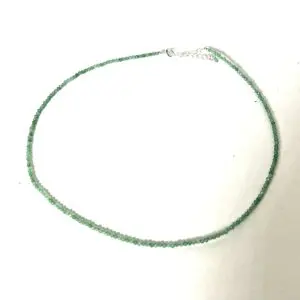 A delicate green beaded necklace with a silver clasp.