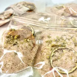 Several clear plastic bags containing a mixture of dried herbs or plant material.