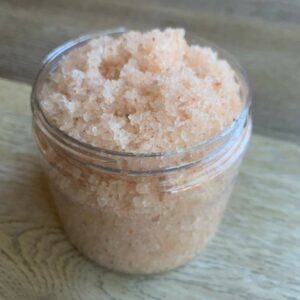 Pink Himalayan salt body scrub in a jar.