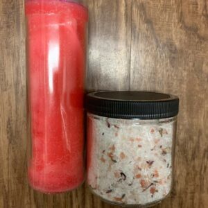 Pink candle and bath salts in jars.