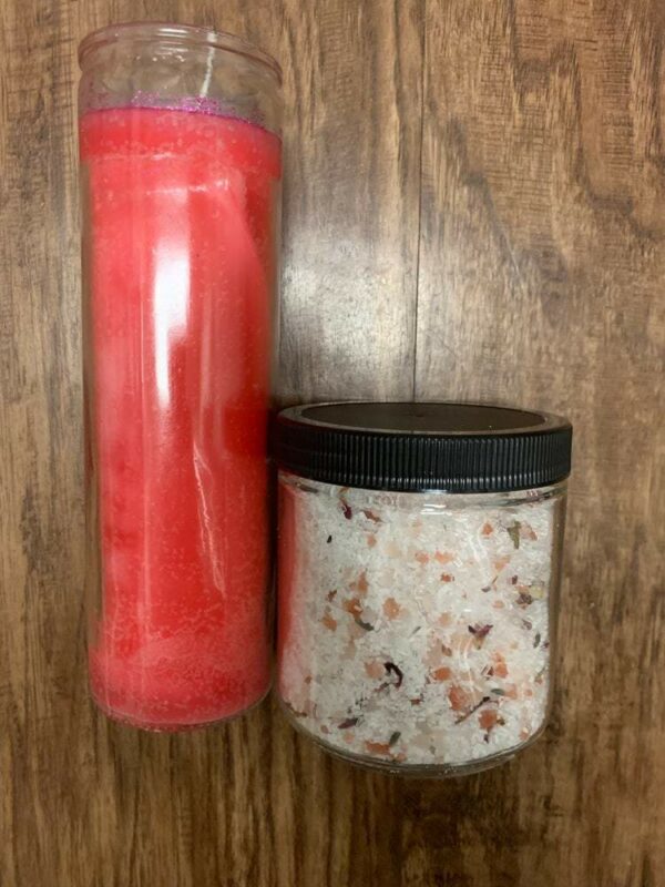 Pink candle and bath salts in jars.