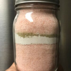 Glass jar filled with pink Himalayan salt.