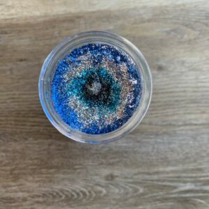 Blue and silver glitter in a jar.